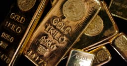 Gold gains as oil slide cools some inflation concerns
