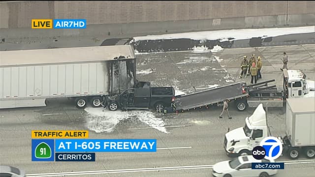 Pickup truck slams into stalled big rig on EB 91 Freeway in Cerritos; fiery crash snarls commute