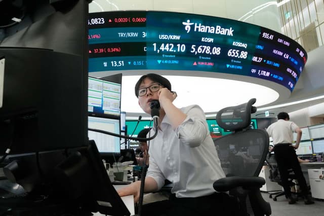 Oil prices gain and Asian shares mostly fall as chipmakers extend losses