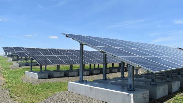 A Connecticut city stood 1,920 solar panels on a sealed garbage hill where no steel post can go in, because a driven pile would punch through the lid keeping decades of trash away from the water, so c