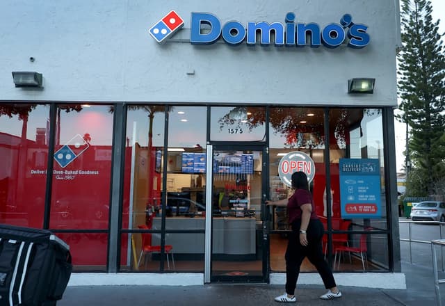 Earnings live updates: Domino's Pizza stock falls amid tough consumer backdrop