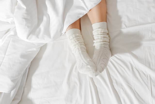 Does Sleeping With Socks on Actually Help You Fall Asleep Faster?